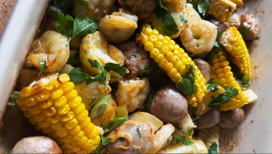 Sheet Pan Prawn ‘Boil’ with Chipolata Meatballs & Spicy Corn Ribs