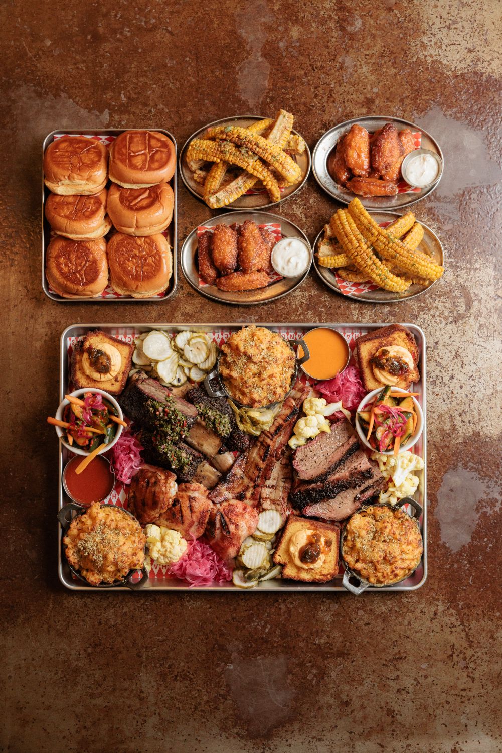 The full Hank's Platter photographed from above with sliders, wings and corn ribs alongside