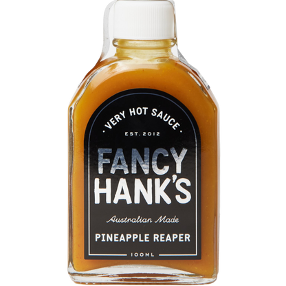 Bottle of Fancy Hank's Pineapple Reaper hot sauce